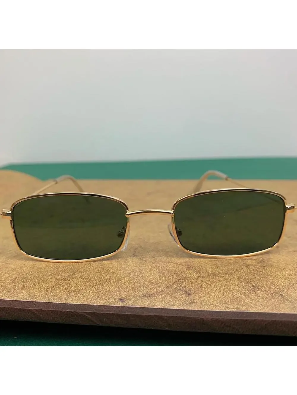 Y2k 2000s vintage green and gold unique slim style sunglasses. Gold trim with